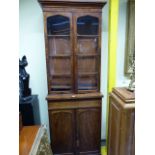 A NEAR PAIR OF VICTORIAN MAHOGANY LIBRARY BOOKCASES. GLAZED DOORS ENCLOSE SHELVES ABOVE APRON DRAWER
