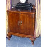 A PAIR OF CARVED WALNUT CONTINENTAL BEDSIDE CUPBOARDS IN THE 18th.C.MANNER, EACH WITH FITTED INNER