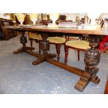 A LARGE OAK REFECTORY DINING TABLE OF 17th.C.DESIGN WITH TRIPLE BALUSTER COLUMN SUPPORTS ON