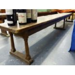 AN ANTIQUE COUNTRY PINE LONG FORM OR BENCH ON TURNED SUPPORTS. L.340 x W.30 x H.44cms.