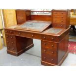 A VICTORIAN MAHOGANY DICKENS DESK WITH TWO BANKS OF FOUR DRAWERS FLANKING WRITING SLOPE OVER TWO