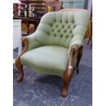 A VICTORIAN WALNUT FRAMED BUTTONED BACK UPHOLSTERED ARMCHAIR ON CABRIOLE SUPPORTS.