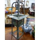 AN ARTS AND CRAFTS BRASS HANGING HALL LANTERN INSET WITH STAINED GLASS PANELS. 23 x 23 x H.73cms.