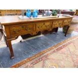 A BESPOKE SOLID YEW WOOD FOUR DRAWER DRESSER BASE ON SHAPED SQUARE FORM LEGS ORIGINALLY PURCHASED AT