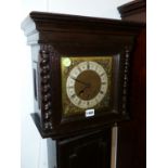 AN EARL 20th.C.OAK CASED GRAND DAUGHTER CLOCK WITH THREE TRAIN SPRING WOUND CHIMING MOVEMENT.