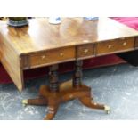 A REGENCY ROSEWOOD AND CROSSBANDED SOFA TABLE ON TWIN CENTRAL COLUMN SUPPORTS AND QUADRUPED SABRE