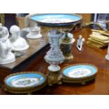A PORCELAIN AND GILT METAL COMPORT, THREE GRADUATED SEVRES STYLE OVAL DISHES ON A FLORALLY ENCRUSTED