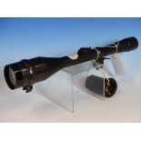 A CERTAR TELESCOPIC SIGHT BY GOETZ OG BERLIN No.12664 WITH RUBBER EYE PIECE, LEATHER CAPS AND