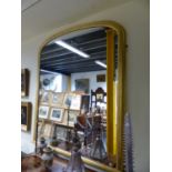 A LATE VICTORIAN GILDED DOMED OVERMANTLE MIRROR 147CM H X 117CM W.