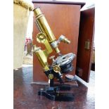 A BAUSCH & LOMB MONOCULAR MICROSCOPE WITH MICRO ADJUSTABLE STAGE, IN ORIGINAL MAHOGANY CASE.