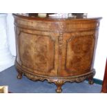 A GEORGIAN STYLE WALNUT D FORM SIDE CABINET WITH GILT HIGHLIGHTED CARVED DECORATION ON SHORT