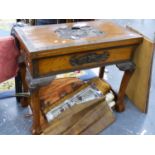 AN ORIENTAL CARVED HARDWOOD FOLD OVER TOP GAMES TABLE WITH TWO END DRAWERS OVER CARVED SHAPED