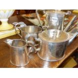 A VICTORIAN FOUR PIECE SILVER PLATED TEA SET WITH ENGRAVED DECORATION.