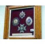 A GROUP OF FOUR FRAMED EMBROIDERED BADGES, ORDERS OF HORATIO NELSON.