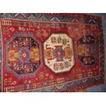 AN ANTIQUE CAUCASIAN KAZAK RUG. 242 x 184cms.