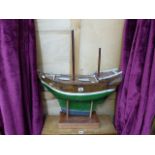 AN EARLY 20th.C.SAILING POND YACHT WITH WEIGHTED KEEL.