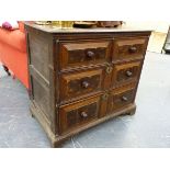 AN 18th.C.OAK SMALL CHEST OF TWO SHORT AND TWO LONG DRAWERS WITH OYSTER VENEER PANEL FRONTS. W.82