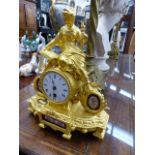 A 19th.C.FRENCH GILT SPELTER AND PORCELAIN CASE MANTLE TIMEPIECE, THE CASE SURMOUNTED BY A FEMALE