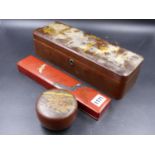 A JAPANESE LACQUER SCROLL BOX. W.30.5cms, A BUN SHAPED BOX WITH A BROWN GROUND. Dia.8.5cms AND A RED
