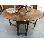 A RARE 17th/18th.C.SOLID YEW WOOD COTTAGE GATELEG TABLE WITH TURNED SUPPORTS AND STRETCHERS, THE
