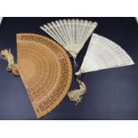A CHINESE IVORY FAN, A EUROPEAN BONE BRISE FAN AND ANOTHER IN WOOD. (3)
