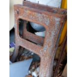 A PAIR OF INDUSTRIAL CAST IRON STANDS. (2)