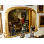 A VICTORIAN GILTWOOD AND GESSO FRAMED OVERMANTLE MIRROR. PLATE SIZE 72 x 97cms.