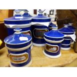 A COLLECTION OF FOURTEEN LARGE AND SIX SMALL ANTIQUE POTTERY APOTHECARY LIDDED POWDER JARS WITH
