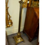 AN EARLY 20th.C.GILT BRASS CORINTHIAN COLUMN ADJUSTABLE STANDARD LAMP.