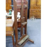 A VICTORIAN OAK ARTIST'S EASEL.