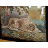 AN EARLY 19th.C.SILKWORK PICTURE OF A RECUMBENT DOG IN A LANDSCAPE IN EGLOISE MOUNT. 28 x 41cms.