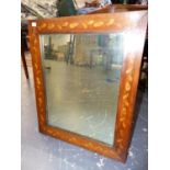 A DUTCH MARQUETRY INLAID RECTANGULAR MIRROR WITHIN A WALNUT FRAME MARQUETRIED WITH FLOWERING VINE.