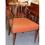 AN INLAID CARVED MAHOGANY REGENCY ARMCHAIR ON SLENDER TURNED FRONT LEGS.