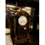 A 19th.C.FRENCH EBONISED AND GILT METAL MOUNTED MANTLE CLOCK WITH URN SURMOUNT, 8-DAY MOVEMENT AND