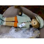 A NORAH WELLINGS TYPE BOY WEARING A BLUE JACKET OVER ORANGE SHORTS. H.48cms, A BABY IN THE SAME
