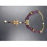 AN ITALIAN DESIGNER PERCOSSI PAPI NECKLACE VARIOUSLY SET WITH GARNETS, PEARLS AND ENAMELLED
