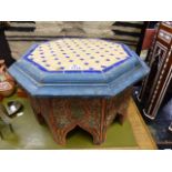 A NORTH AFRICAN MOORISH LOW OCTAGONAL TABLE / STAND WITH MOSAIC INSET TOP, POLYCHROME DECORATION.