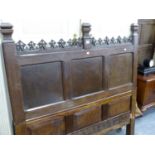 AN 18th.C.AND LATER CAVED OAK PANEL MOUNTED AS A HEADBOARD. W.140cms.