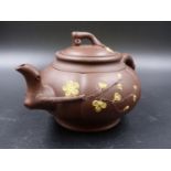 A TWO TONE YIXING TEA POT, INTERNAL STRAINER AND COVER, THE LIVER RED MELON SHAPE WITH RUSTIC