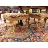 A PAIR OF 19th.C.AND LATER FRENCH WALNUT STOOLS WITH CARVED LEGS UNITED BY X STRETCHERS. (2)