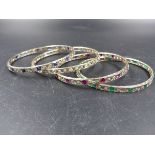 FOUR ART DECO GEMSET BANGLES, EACH ONE HAND MADE IN 18ct WHITE GOLD AND BORDER ENGRAVED .