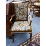 AN EARLY GEORGIAN DESIGN MAHOGANY ARMCHAIR WITH FLORAL AND ARMORIAL NEEDLEPOINT UPHOLSTERY.