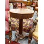 A VICTORIAN MAHOGANY OCCASIONAL TABLE WITH RISING TOP. Dia.49cms.