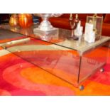A MID CENTURY GLASS TWO TIER COFFEE TABLE. W.140 x D.54 x H.36cms.