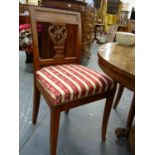 A SET OF FOUR 19th.C.CONTINENTAL OAK AND ELM DINING CHAIRS WITH CARVED BACK PANELS. (4)