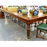 A GOOD QUALITY BRIGHTS OF NETTLEBED MAHOGANY LIBRARY TABLE WITH LEATHER INSET TOP ON TURNED REEDED