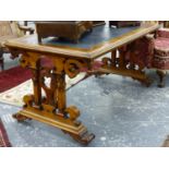 AN EARLY VICTORIAN WALNUT LARGE WRITING OR LIBRARY TABLE ON SCROLL DECORATED END SUPPORTS IN THE