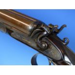 SHOTGUN.A RARE 10 BORE DOUBLE HAMMER GUN WITH BAR IN WOOD ACTION BY LANCASTER, LONDON. A CURRENT