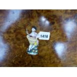 A GERMAN PORCELAIN GARDENER FIGURAL SCENT BOTTLE. H.8.5cms.