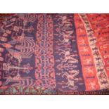 AN INDONESIAN TRIBAL JOINED IKAT PANEL WITH EQUESTRIAN AND OTHER FIGURES.